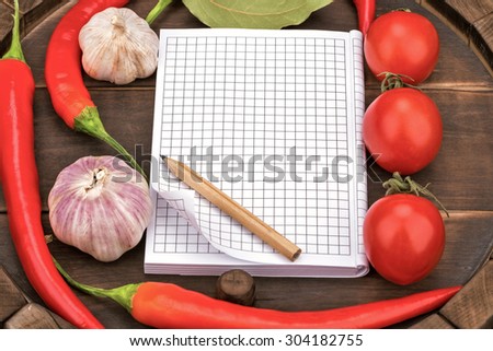 Notebook with recipes and shopping list in the kitchen