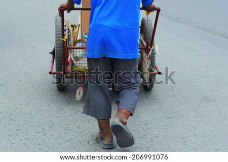 this man walking and searching recycle garbage for sell