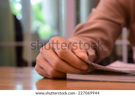 this man reading interest page magazine