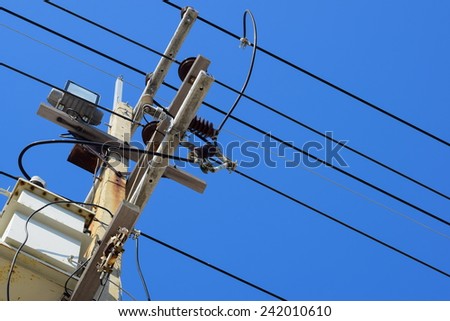 electricity post over head have light and transformer