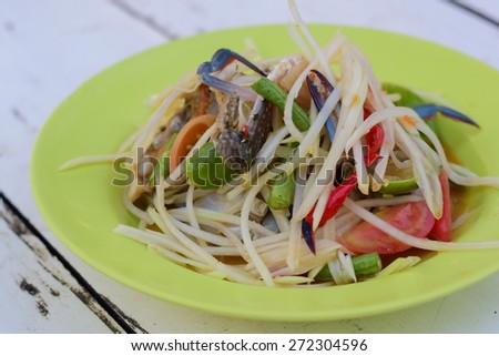 spicy papaya salad with crab on table.when you go to the beach it is very good food