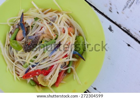 spicy papaya salad with crab on table.when you go to the beach it is very good food
