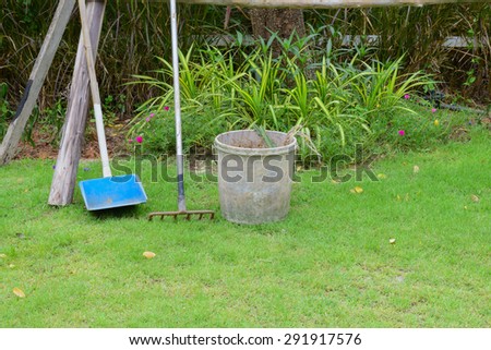 garden cleaning tool put on grass in garden after use already