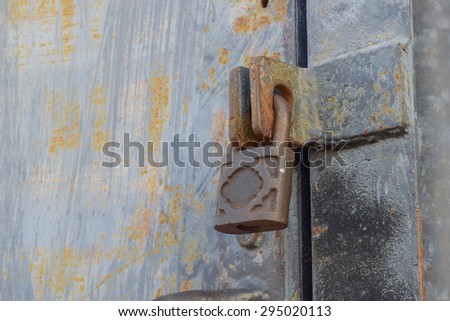 Rusty key lock old warehouse door