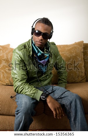 a young african american youth listens to his favorite tunes
