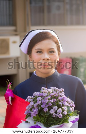 SURATTHANI, THAILAND- MAY 15: Female students smiling happily in the graduate nursing on May 15, 2015 in Suratthani, Thailand. New Nurse Graduates from Nursing College, Surat Thani.