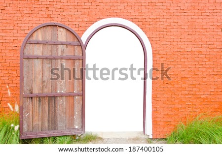Old door wooden is open on orange wall