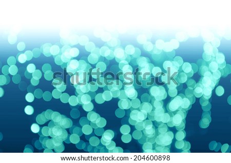 Blue Lights Festive background. Abstract Christmas twinkled bright background with bokeh defocused  lights