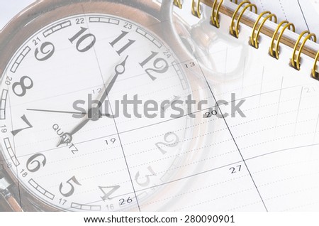 sheet of a calendar and diary with the number of days and clock close-up