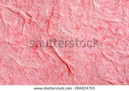 Red paper background with fiber structure. Recycle paper.