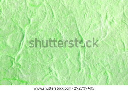 Green paper background with fiber structure. Recycle paper.