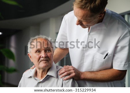 Health-care worker interested in health elderly man