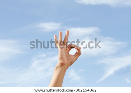 men's hand shows the sign that everything is fine, everything is very good. Space for text. Left, right. Concept about the good things and the good news.