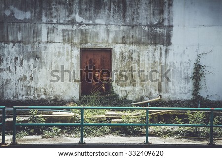 Single red dark door in Old City Wall