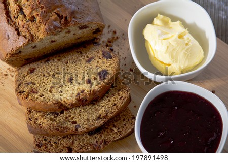 Date Loaf, Jam and Butter on Cutting Board