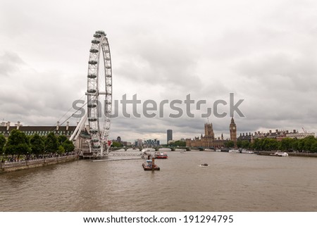 London, England - July 18, 2008 : London cityscape on a cloudy day. Taken from Hungerford Bridge.