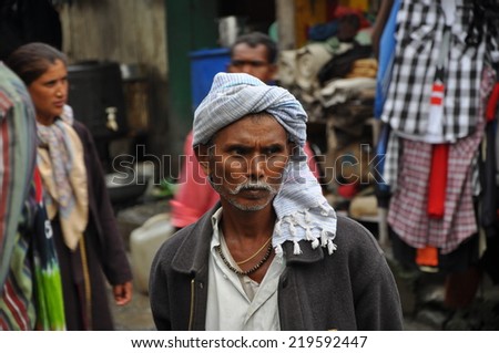 VARANASI, India - Aug, 14: Portrait of a market vendor working on a market on August, 14, 2010 in Varanasi, India.