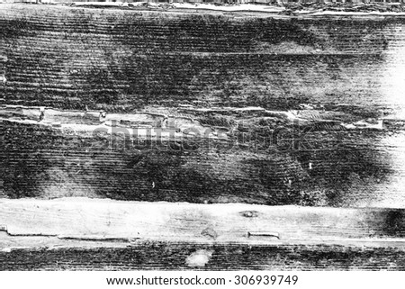 Wooden texture of black color with scratches and cracks, which can be used as a background