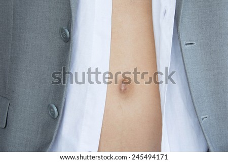 close up Belly of A business man in grey suite on white background