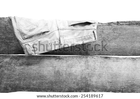old jean hanging on the wall in white tone isolated
