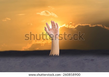 hand pop up from ground with Silhouette of  sky and cloud
