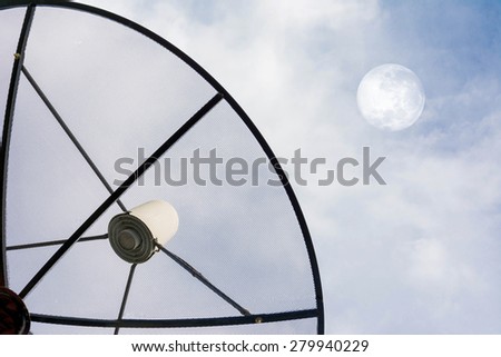 Satellite dish against cloudy sky with moon on sky . . Elements of this image furnished by NASA