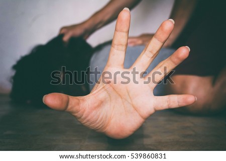 Fear woman being abuse on ground with man on her body and holding her hairs ( abuse concept, sexual abuse)with shadow edge