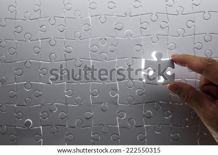 puzzle piece coming down into it\'s place