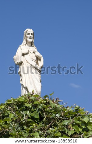 Jesus\' white statue on a background of the blue sky