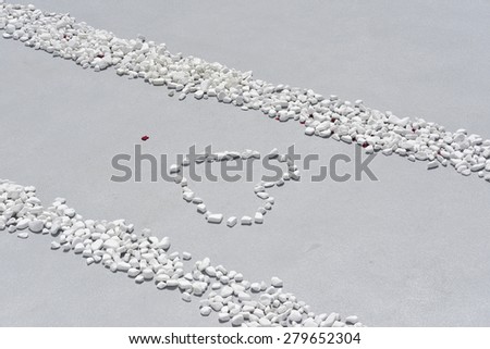 Close up of white stones, pebbles with heart,wedding entrance