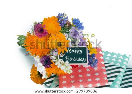 Flower bouquet, presents and tag islolated on white background