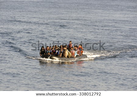 LESVOS, GREECE october 12, 2015: Refugees arriving in Greece in dinghy boat from Turkey. These Syrian, Afghanistan and African refugees land their boat at the North coast of Lesvos near Molyvos.