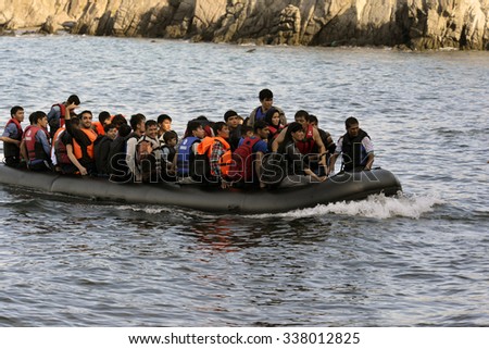 LESVOS, GREECE october 12, 2015: Refugees arriving in Greece in dinghy boat from Turkey. These Syrian, Afghanistan and African refugees land their boat at the North coast of Lesvos near Molyvos.