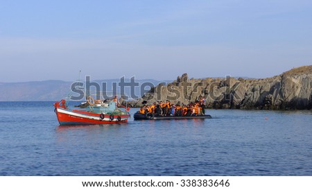 LESVOS, GREECE october 18, 2015: Refugees arriving in Greece in dingy boat from Turkey. These Syrian, Afghanistan and African refugees land their boat at the North coast of Lesvos.