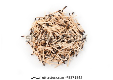 Round heap of burnt matches. On a white background