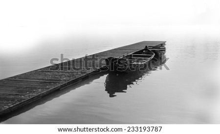 Boat on the foggy lake