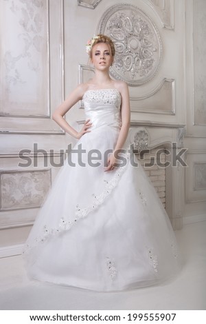 Beauty woman with wedding hairstyle and makeup. Bride fashion. Jewelry and Beauty. Woman in white dress,perfect skin, blond hair. Girl with stylish haircut.