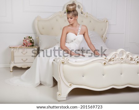 Beauty woman with wedding hairstyle and makeup. Bride fashion. Woman in white dress,perfect skin, blond hair.