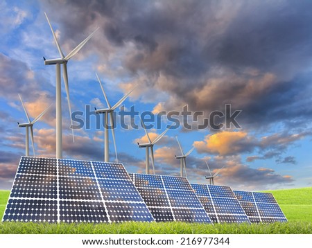 solar energy panels and wind turbine in sunset.