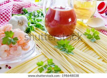 Ingredients for italian spaghetti  tomato sauce,garlic, shrimps, parsley leaves, and  pepper