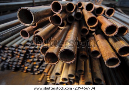 Iron rusty pipe in an industrial warehouse