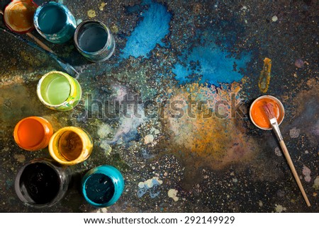 Artist\'s Workshop. Open paint-stained hands.