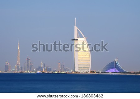 DUBAI, UAE - NOVEMBER 2 :The world\'s first seven stars luxury hotel Burj Al Arab seen alongside of Jumeirah Beach hotel and Burj Khalifa, November 2, 2012 in Dubai, United Arab Emirates