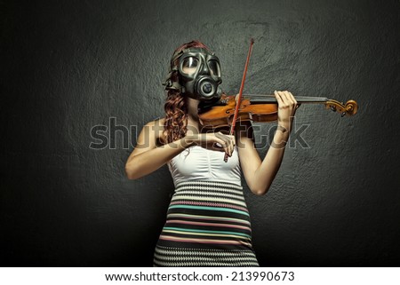 Gas mask violin player woman