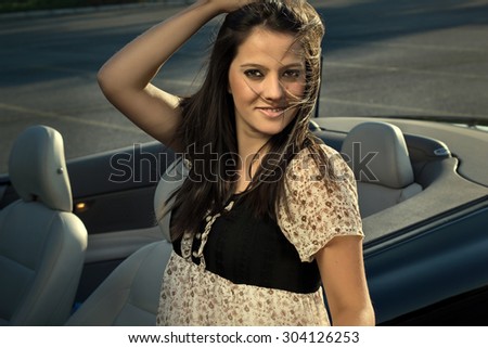 Luxury car and beautiful driver