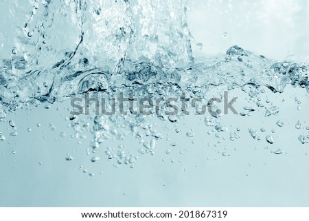 Water and air bubbles over sky background