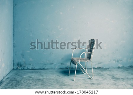 old chair in blue grunge room