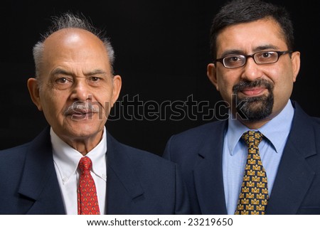A portrait of two Asian business executives