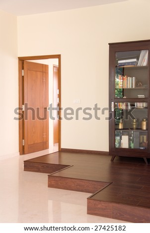 An interior of a home with book cupboard and doors