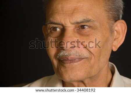 A portrait of a senior Indian man